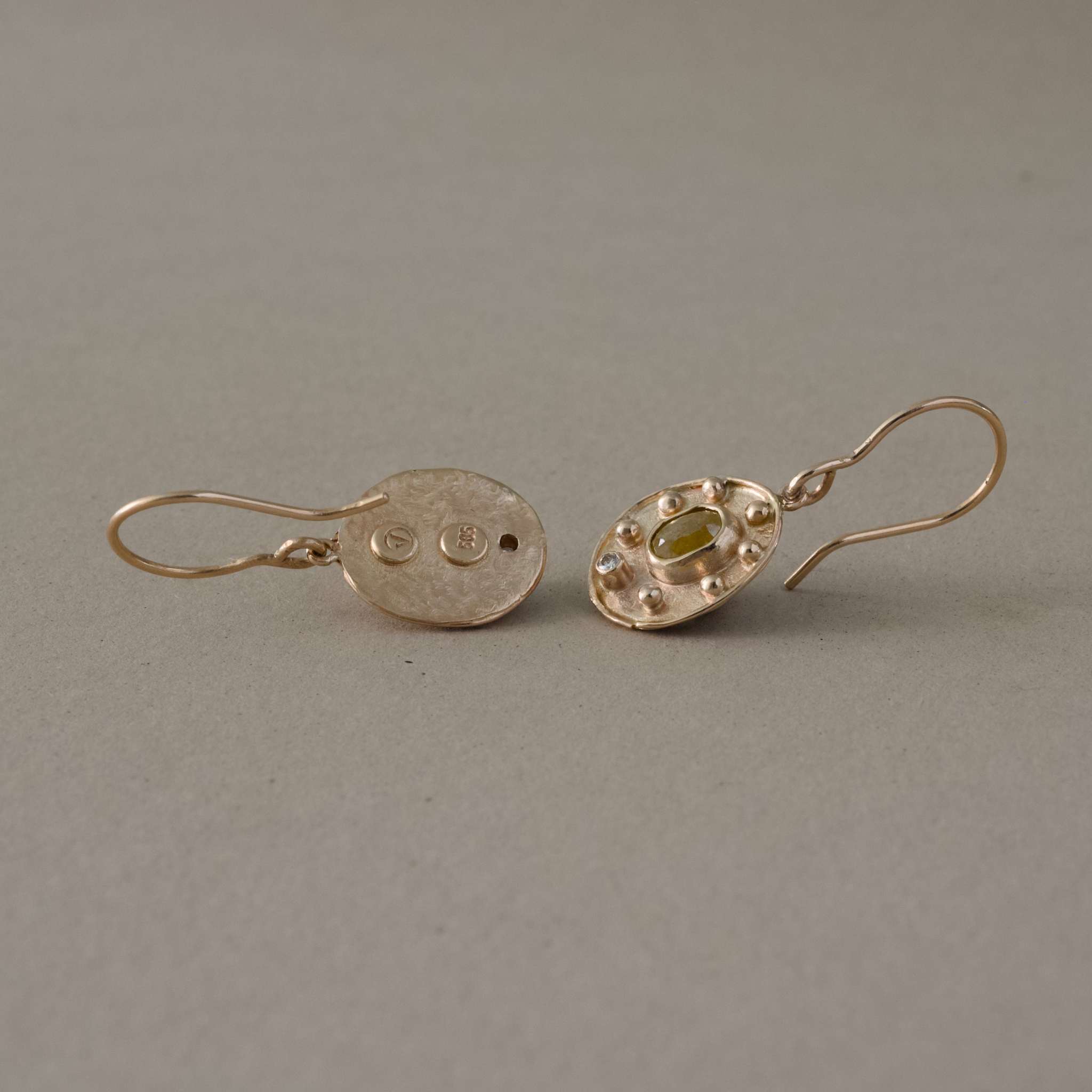 handcrafted raw diamond earrings with natural diamonds in gold setting.