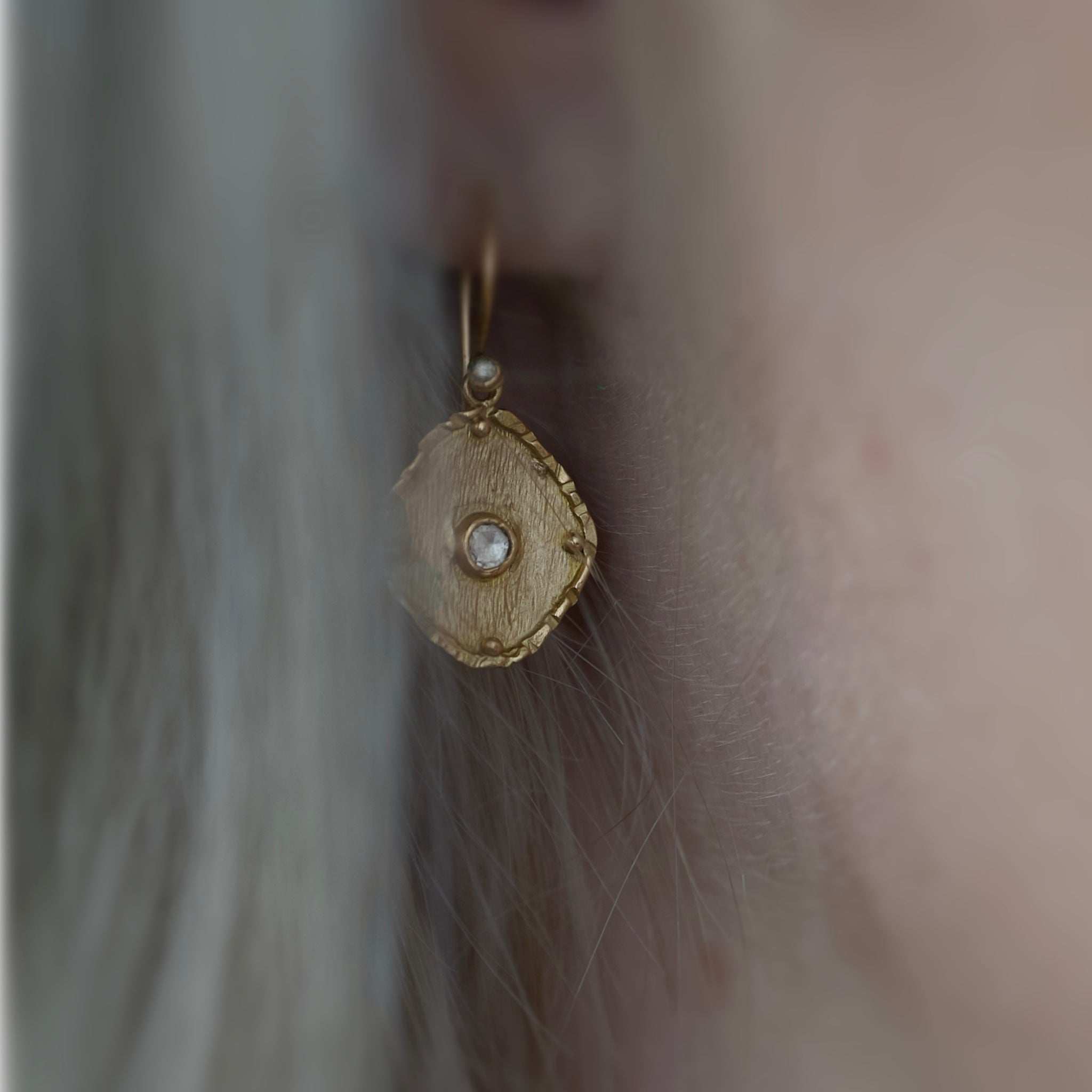 florin rose cut diamond earrrings in ear 