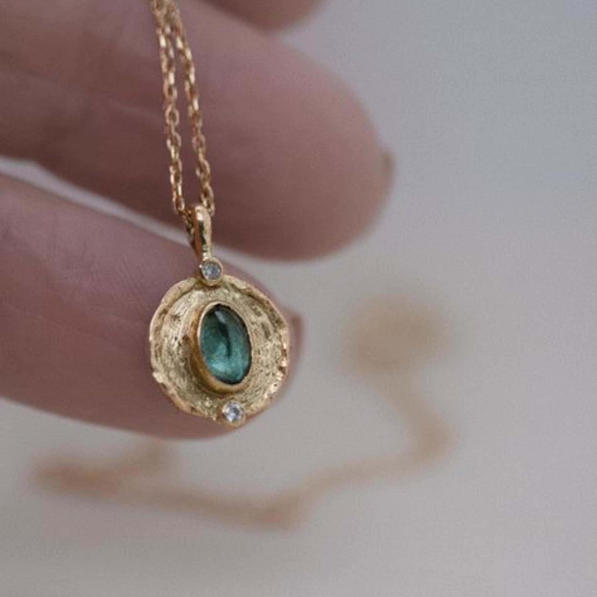 Florin Indicolite Tourmaline necklace with brushed gold medallion and diamond frame