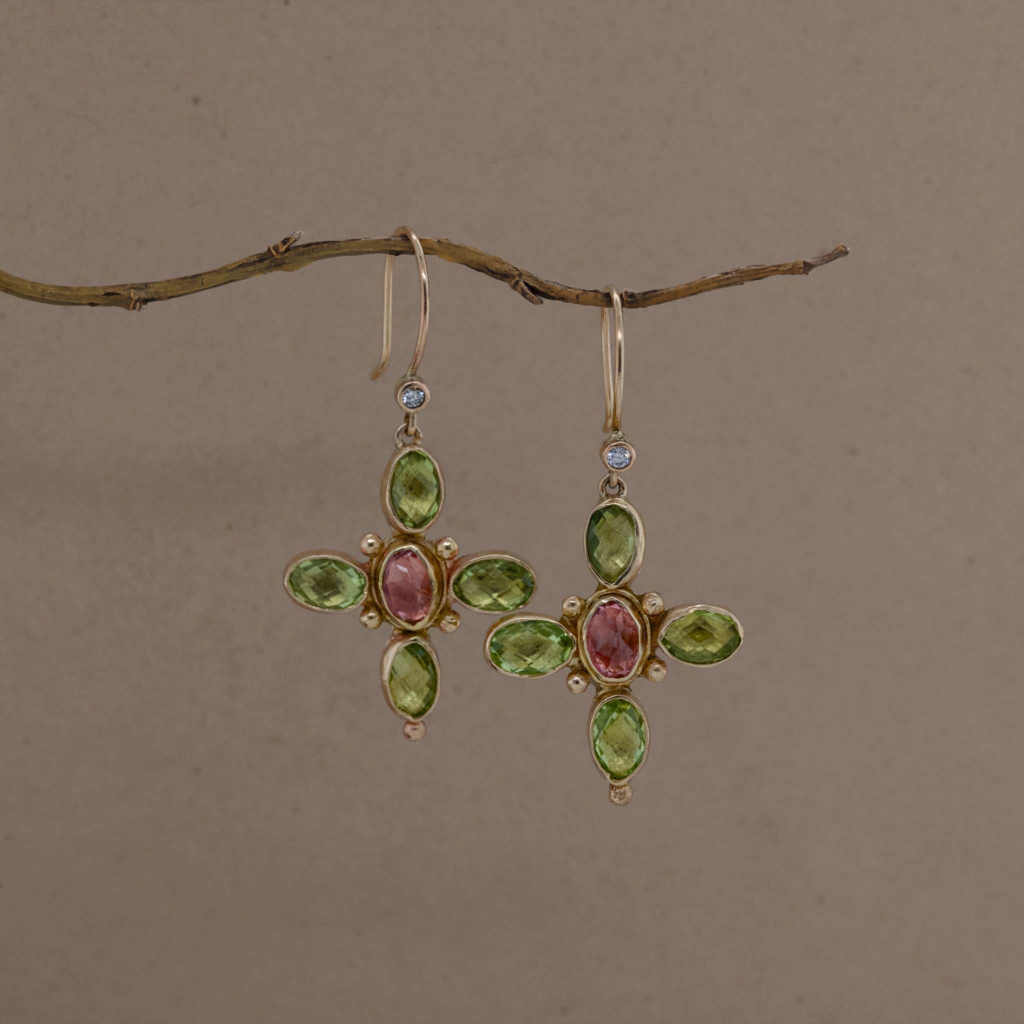 Quattro Peridot Tourmaline Diamond Earrings with green peridot, pink tourmaline, diamonds, and gold setting