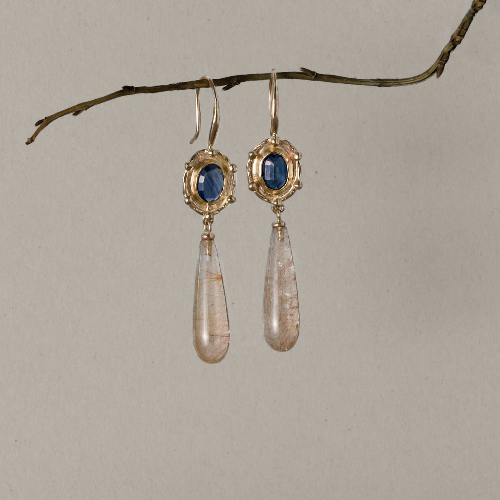 Florin Sapphire Quartz drop earrings with gold setting and teardrop quartz pendants