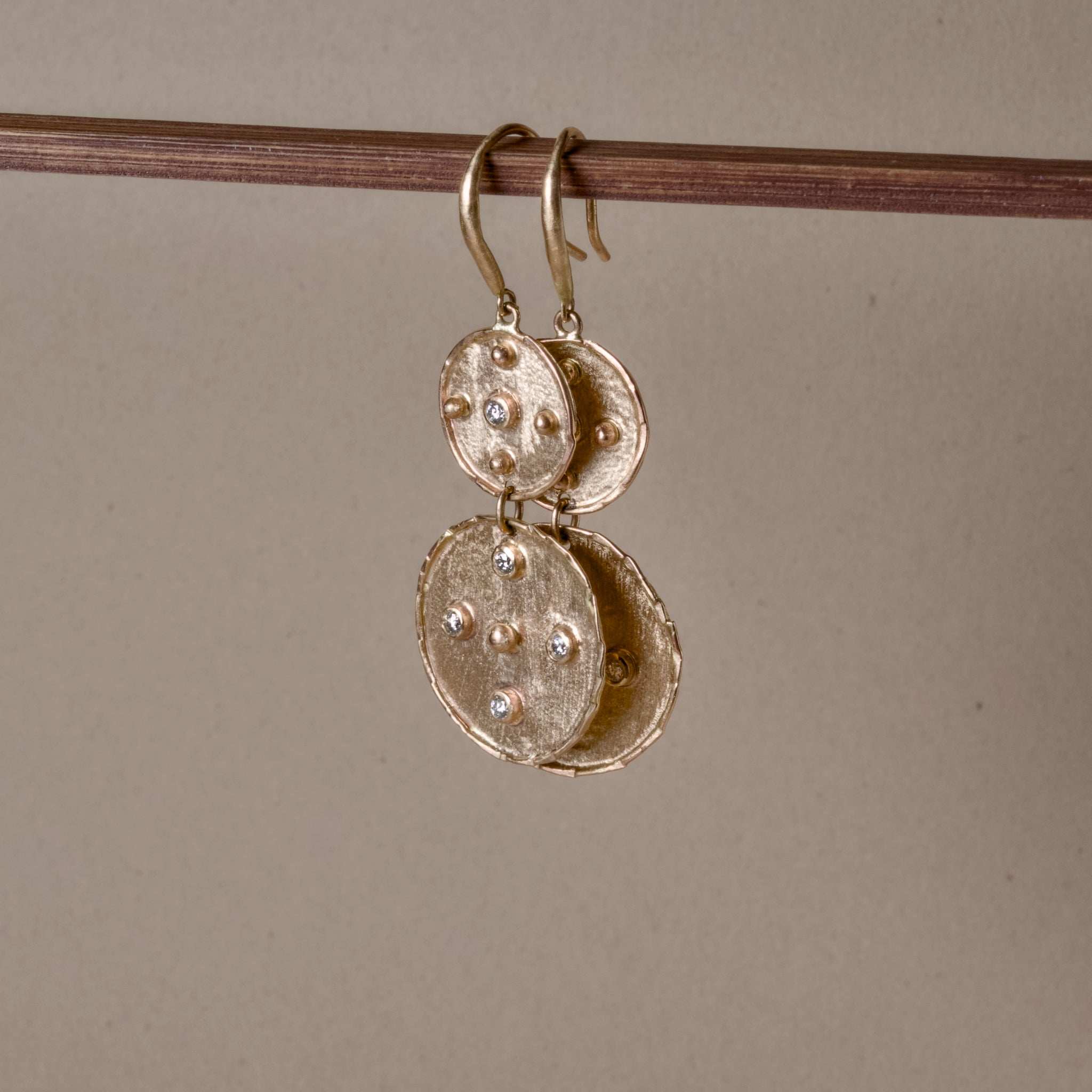 Handmade Florin Double Disc Diamond Gold Earrings with hammered 14ct gold medallions and white diamonds.