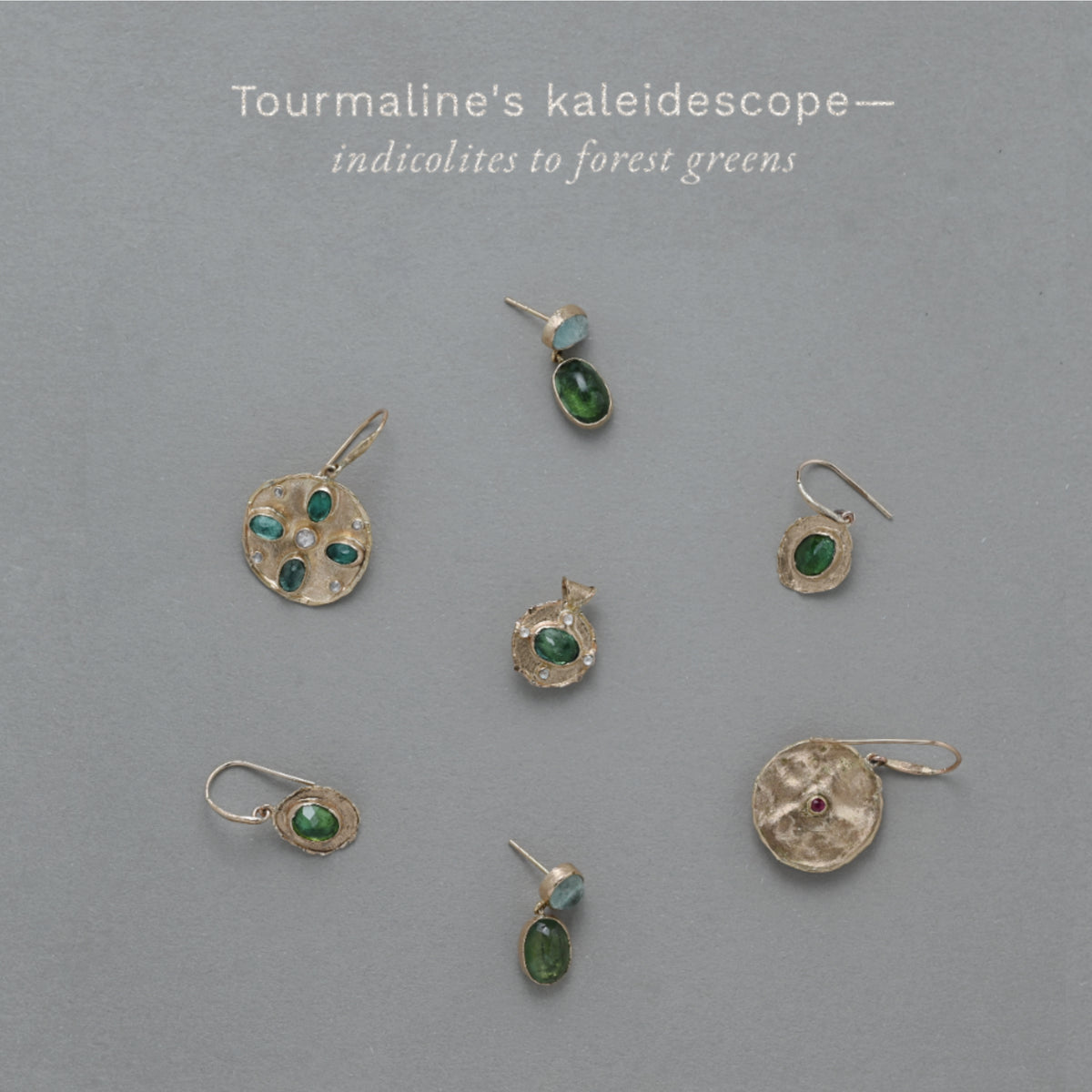 A flat lay collection of Vermilion Jewellery 14ct solid gold Tourmaline medallions and earrings. 