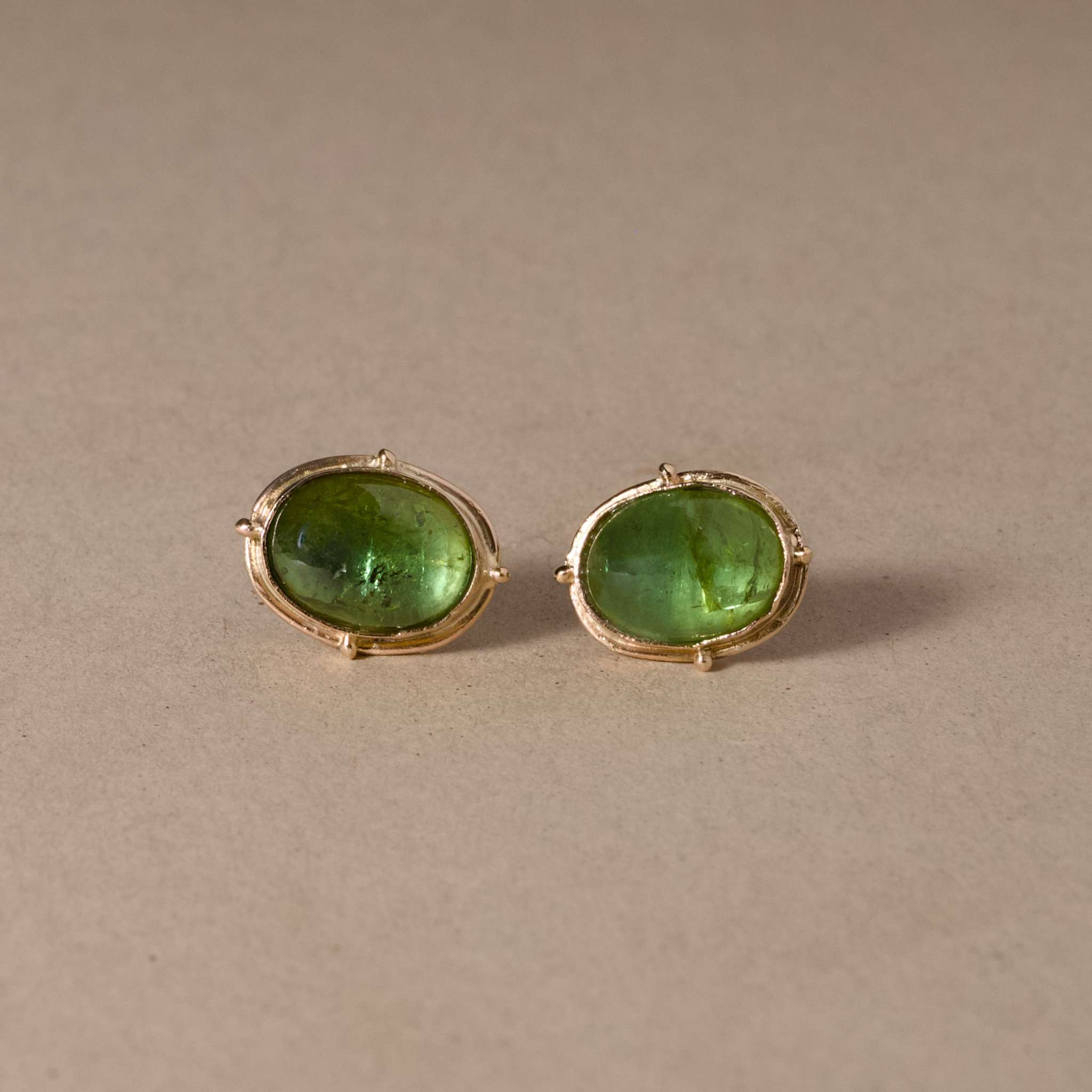 handmade earrings with Green tourmaline set in 14ct gold.