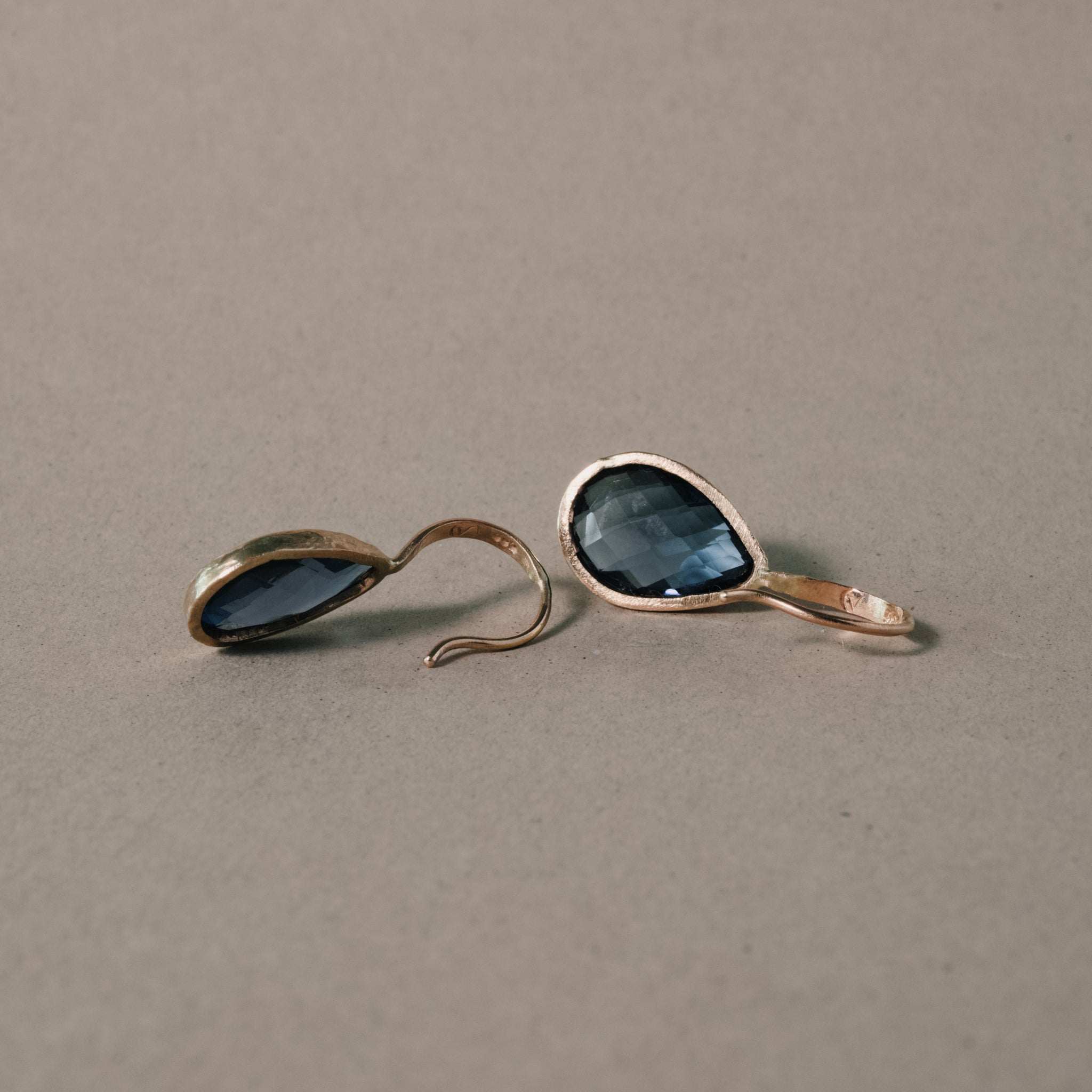 Elegant London blue topaz earrings with 14ct gold textured setting.