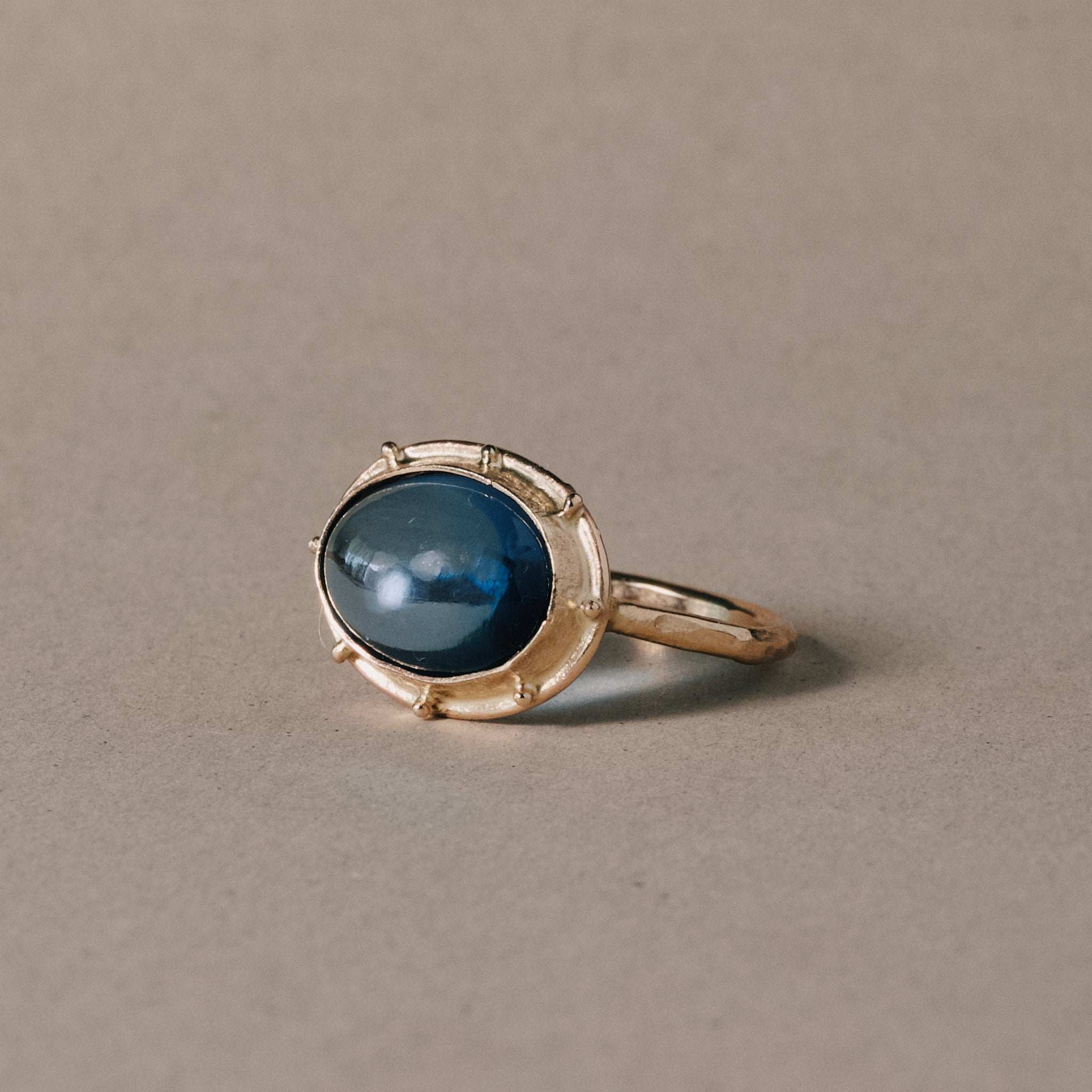 Large London blue topaz ring set in 14ct gold with accents.