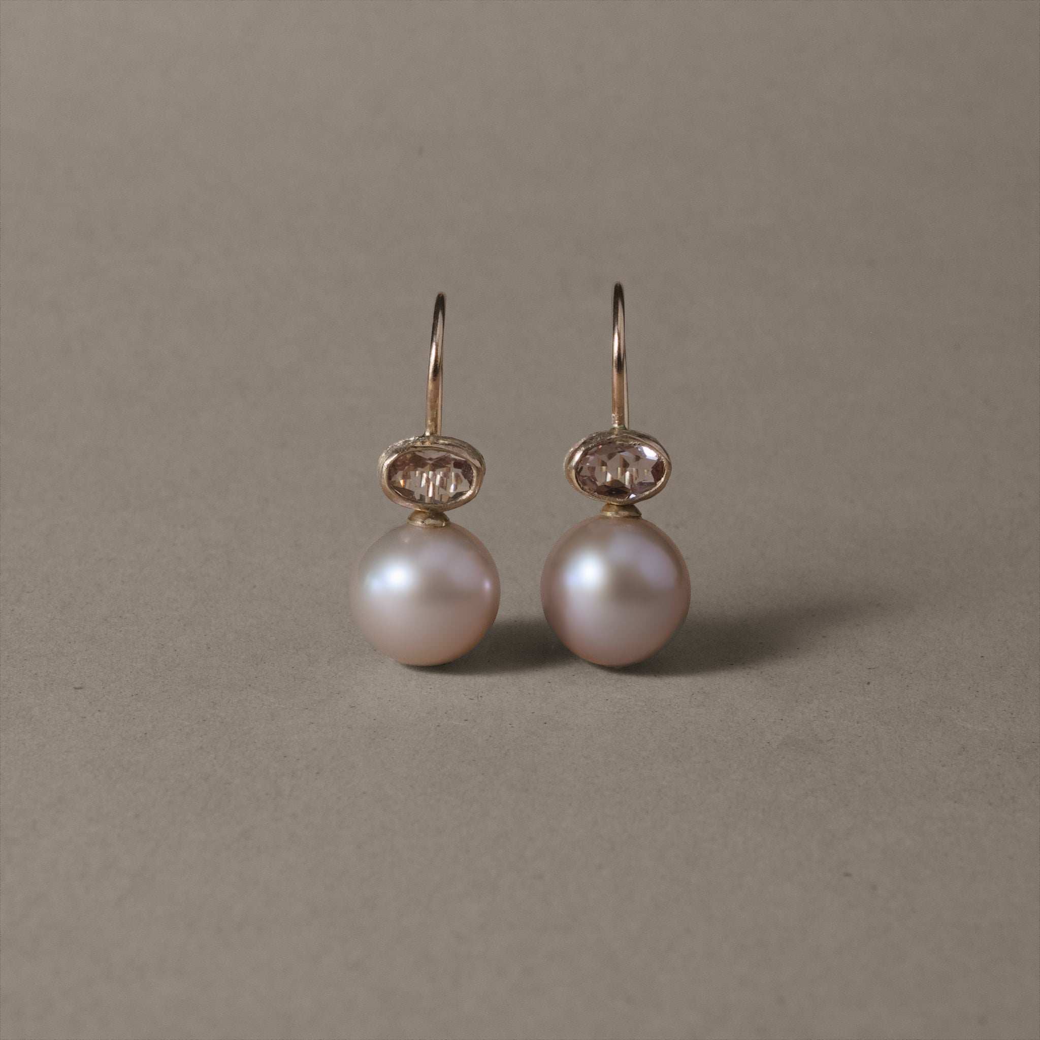 Elegant morganite and pink pearl earrings in gold setting.