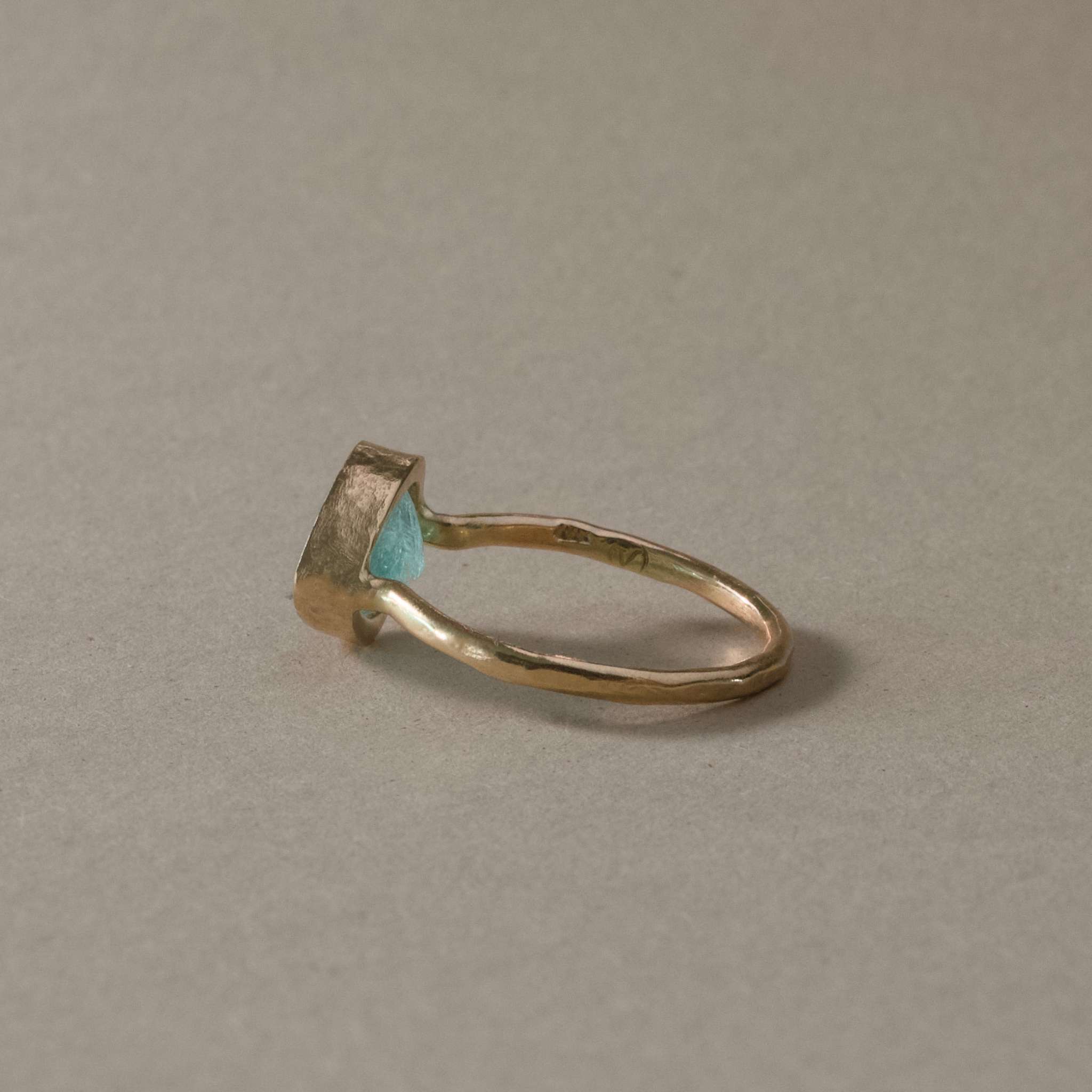 Pero Blue Paraíba Tourmaline Ring on hammered gold band.