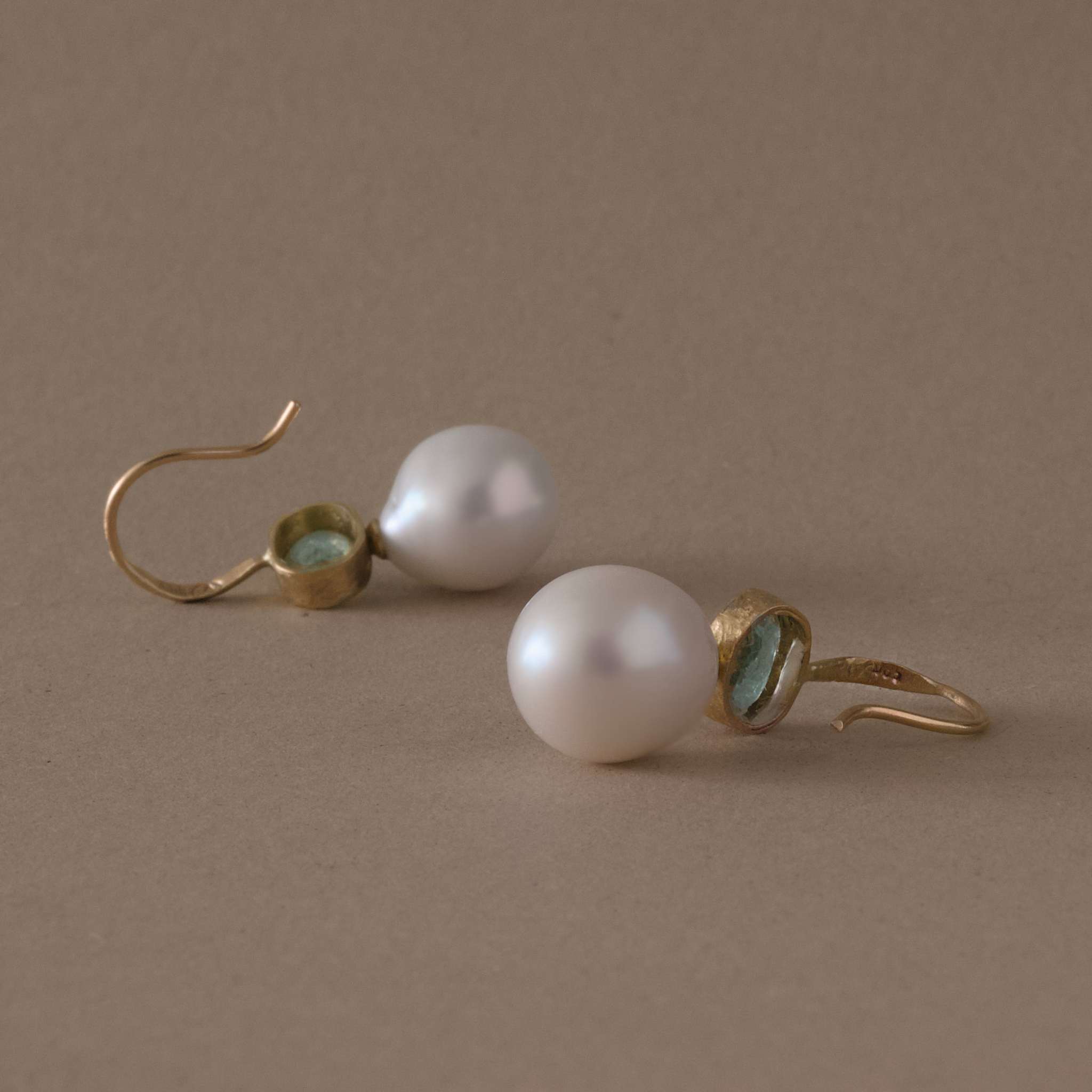 handmade paraíba tourmaline pearl earrings in 14ct gold with round freshwater pearls.