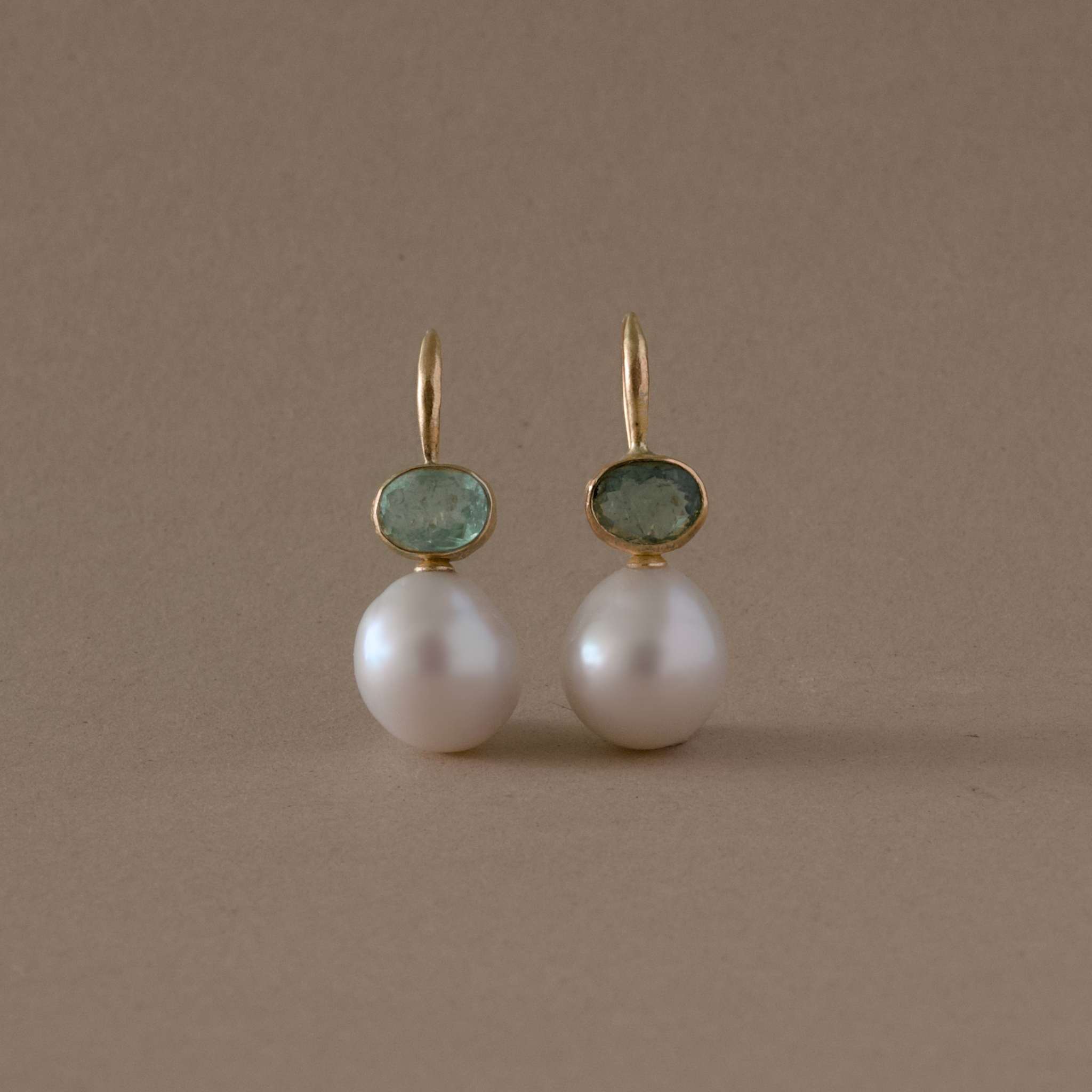 handmade paraíba tourmaline pearl earrings in 14ct gold featuring green tourmaline and freshwater pearls.