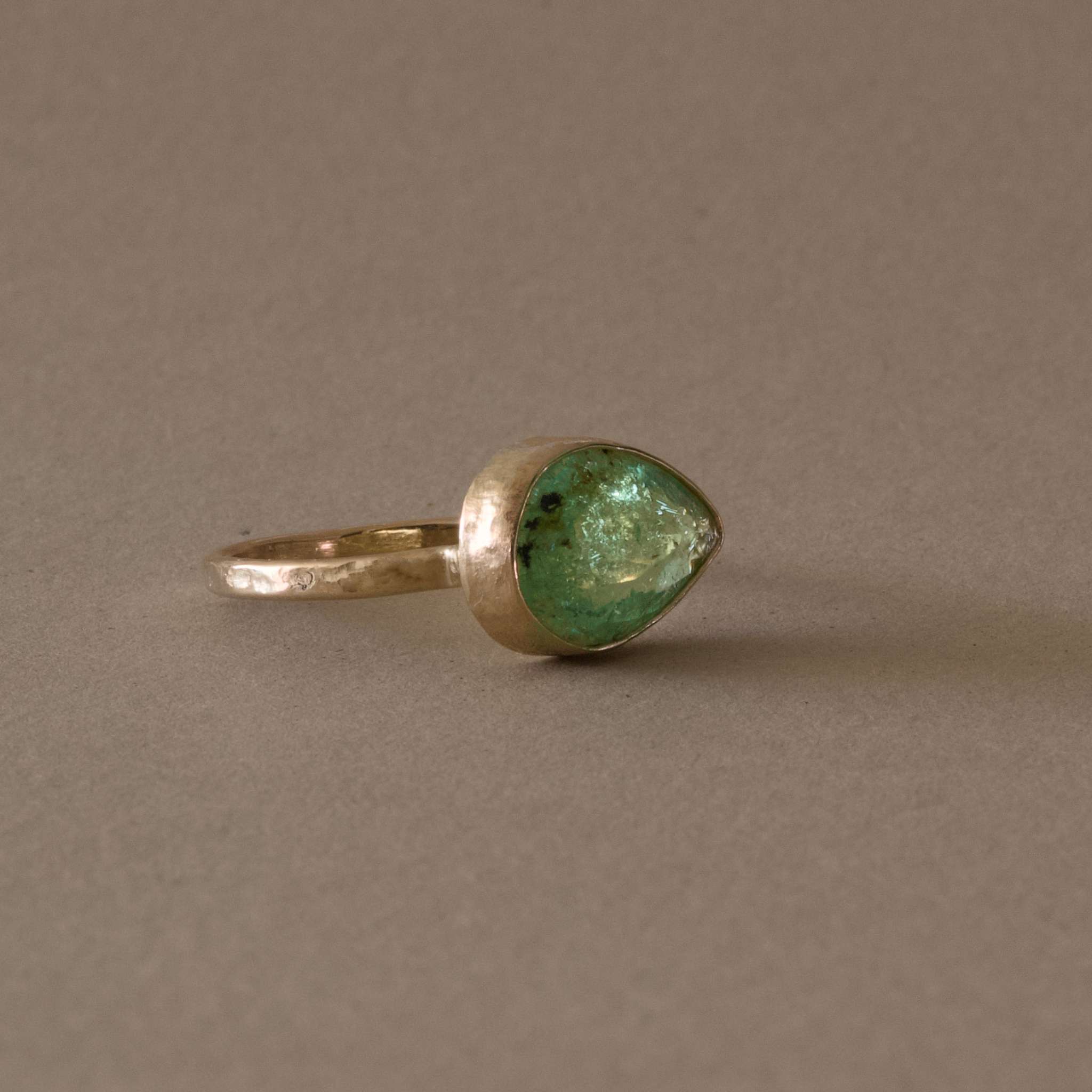 Pero Paraiba Tourmaline Ring with hammered gold band.