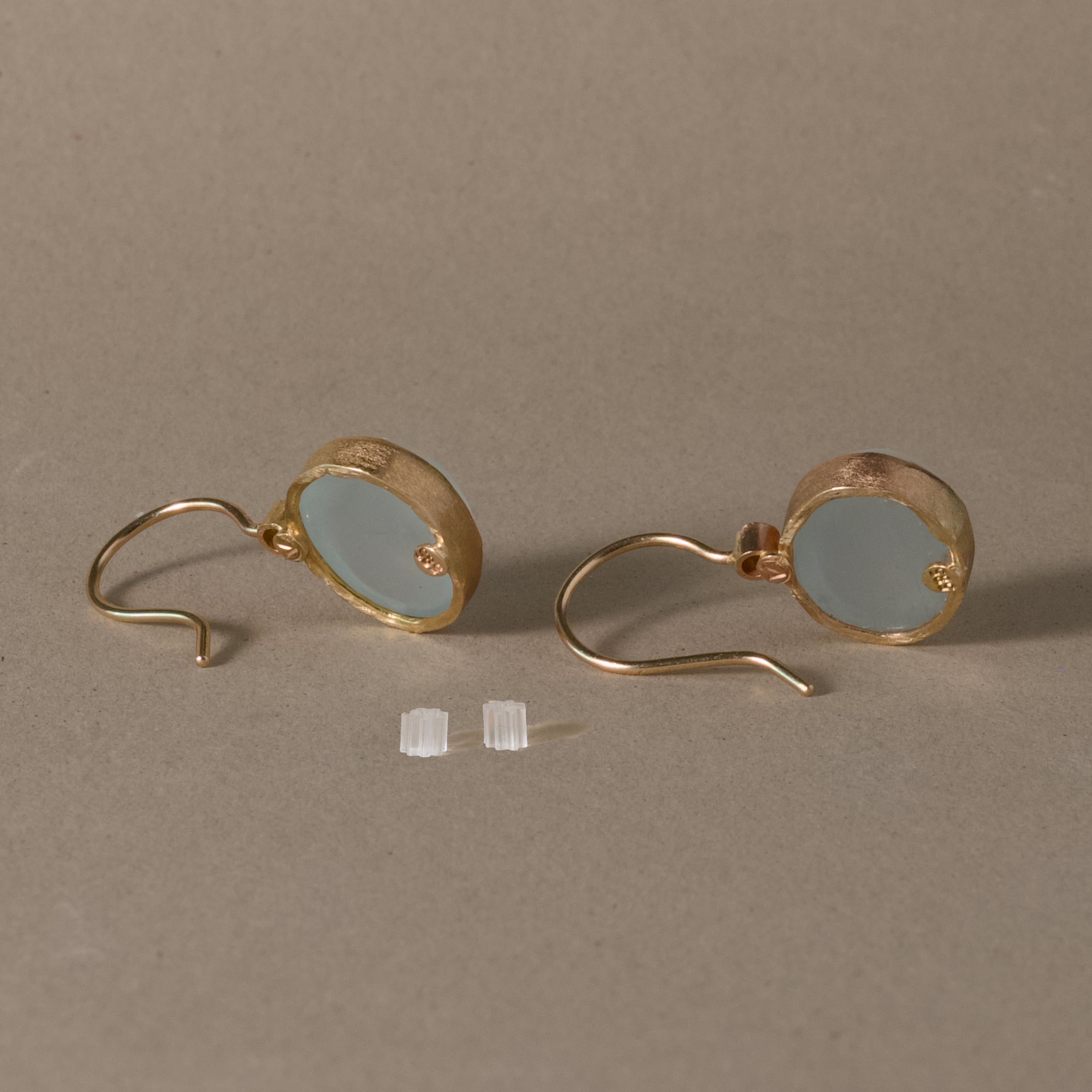 pero aquamarine diamond earrings with pale blue gemstones and diamonds set in 14k gold.