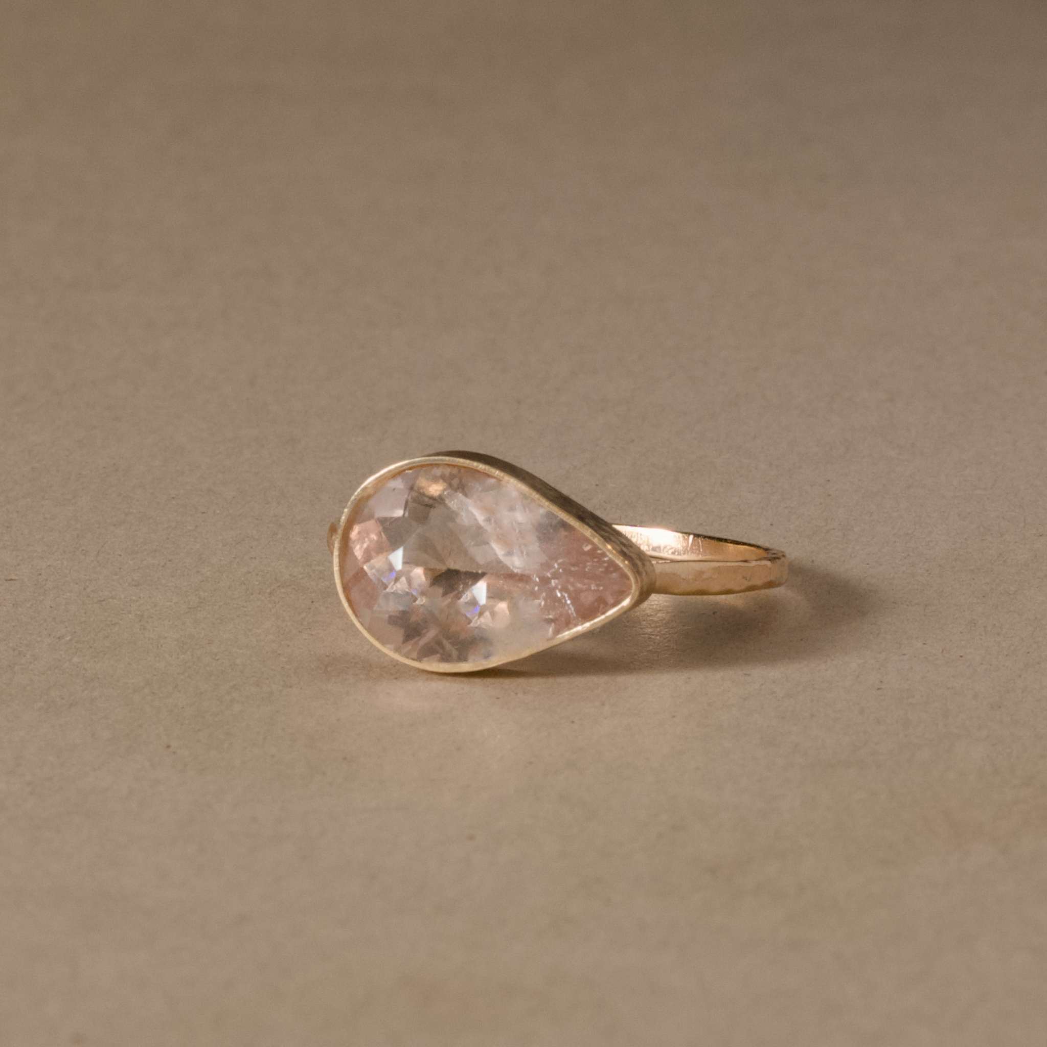 Pear-shaped Morganite gemstone ring in 14ct hammered gold.