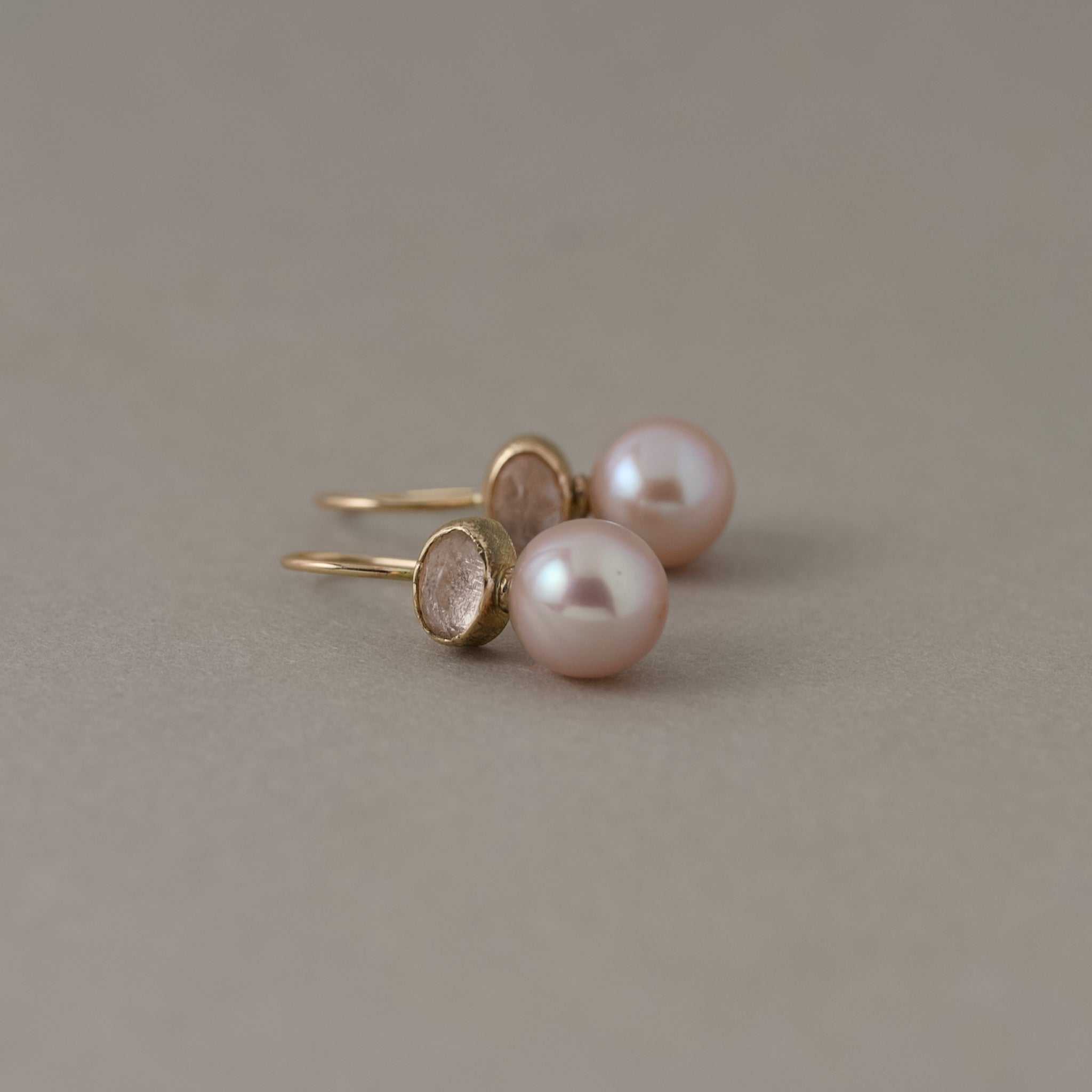 Delicate pink pearl earrings with peach morganite ovals set in rich gold