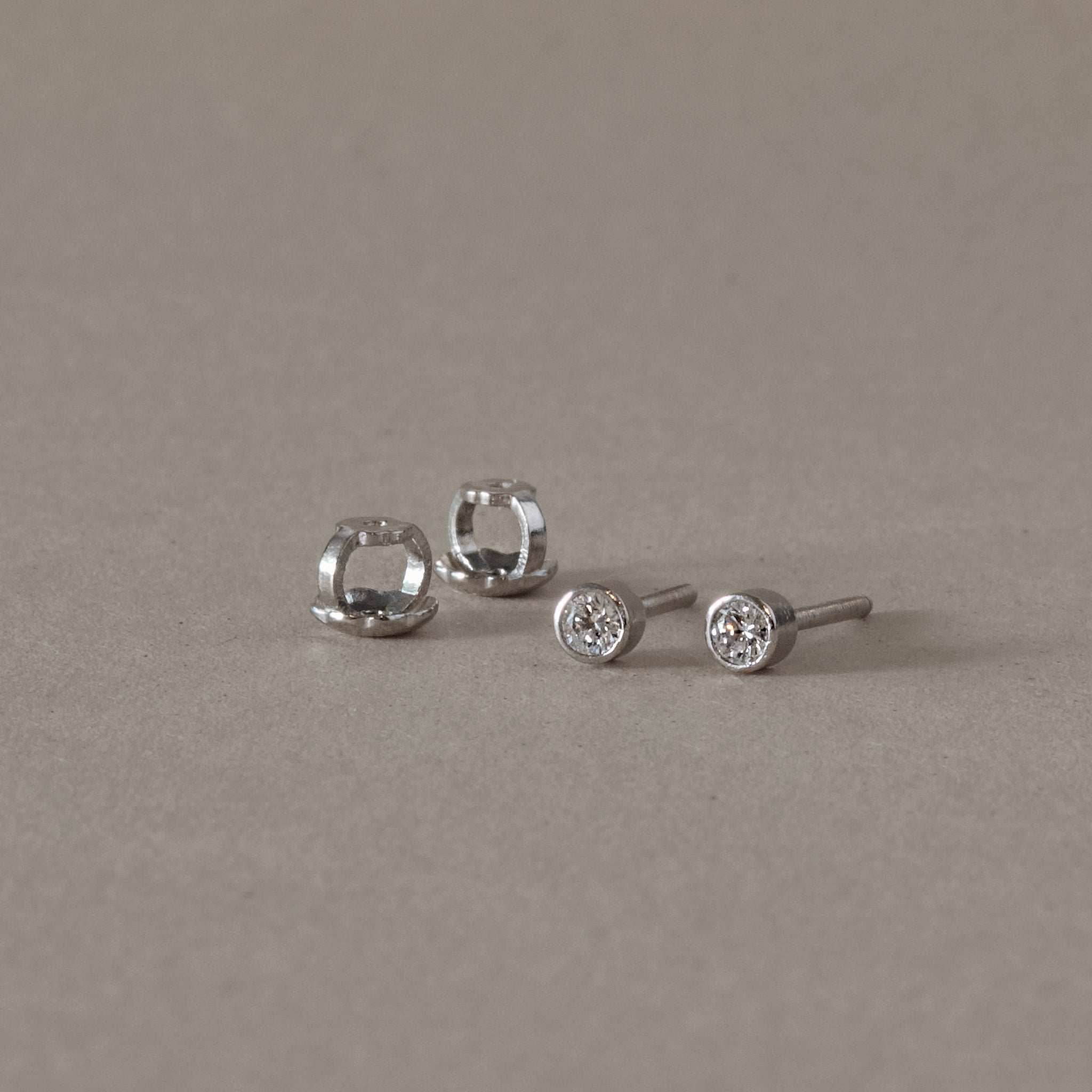 Platinum Diamond Stud Earrings with Bezel Set Natural Diamonds