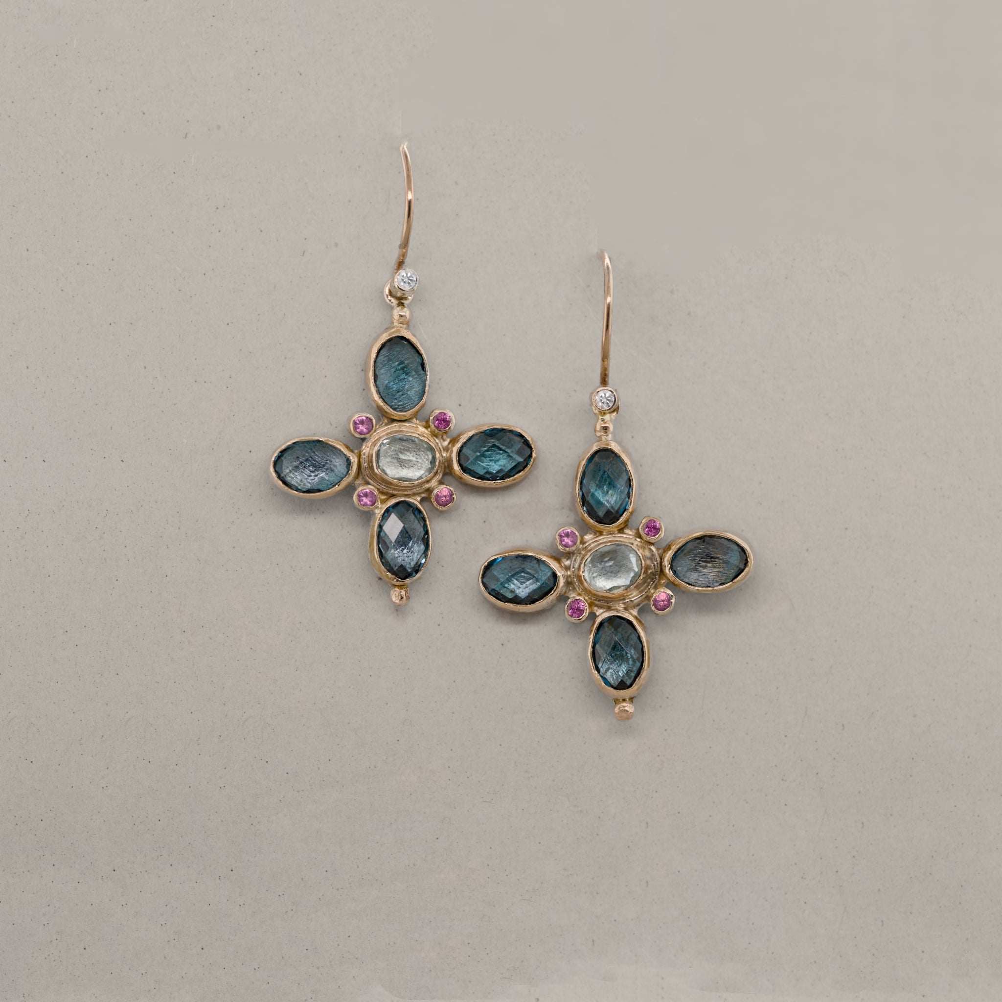 Handmade 14ct gold earrings with blue topaz, aquamarine and pink sapphire.