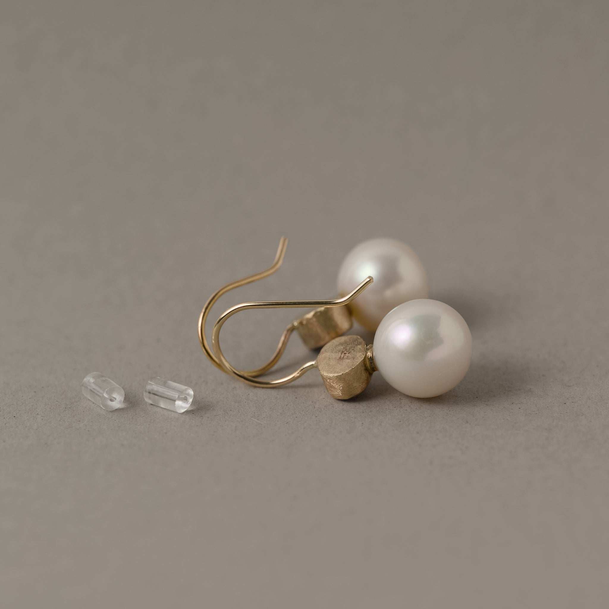 Back view of aquamarine pearl earrings in 14ct gold
