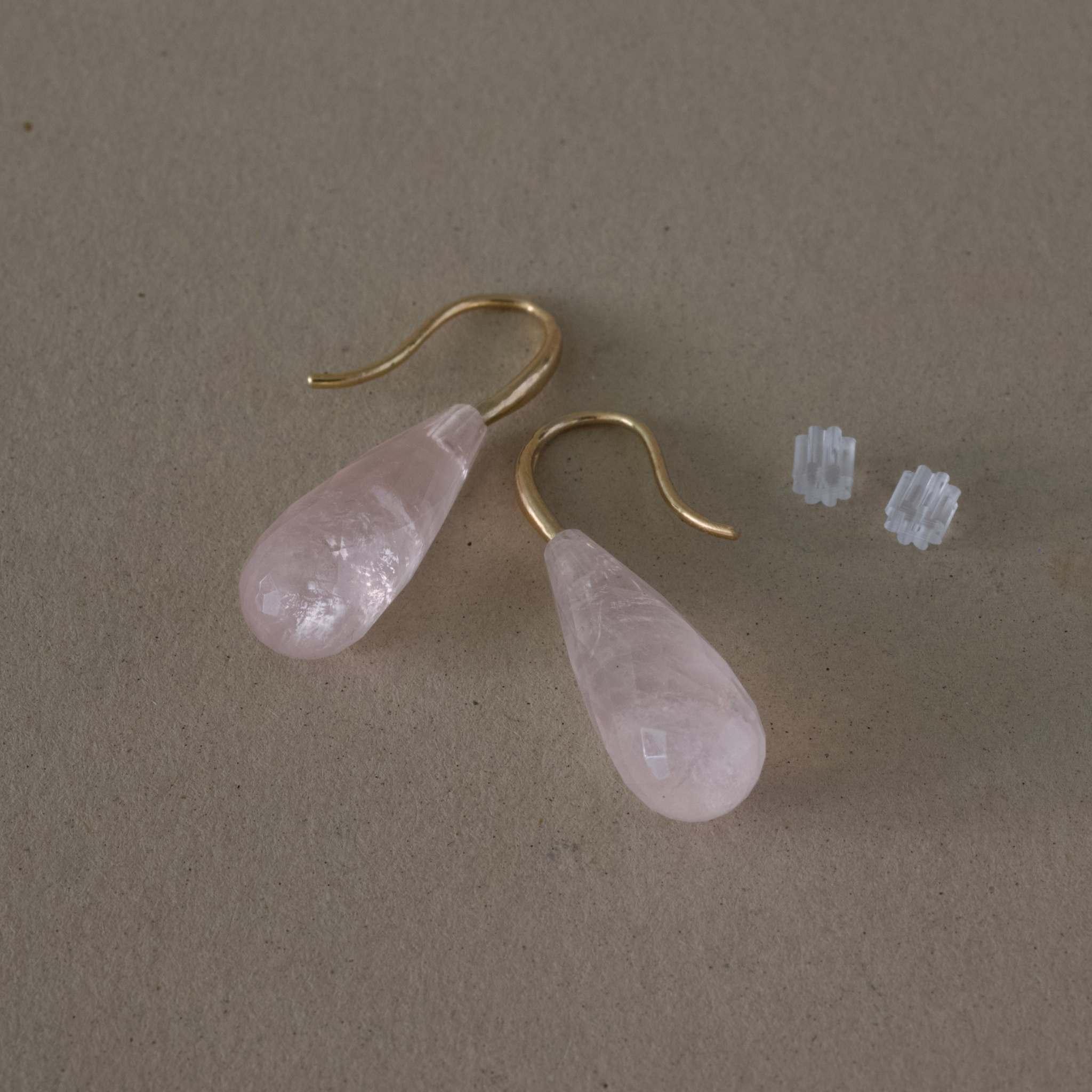 Rose Quartz Drop Earrings with 14ct gold hooks on display.