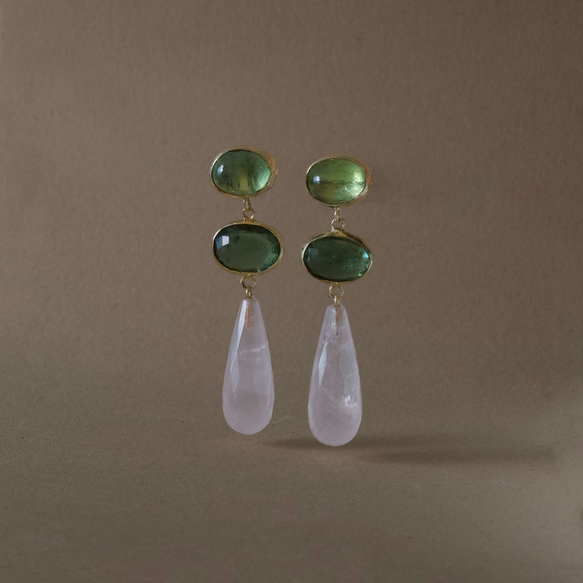 green tourmaline rose quartz earrings in gold with green tourmaline and rose quartz drop.