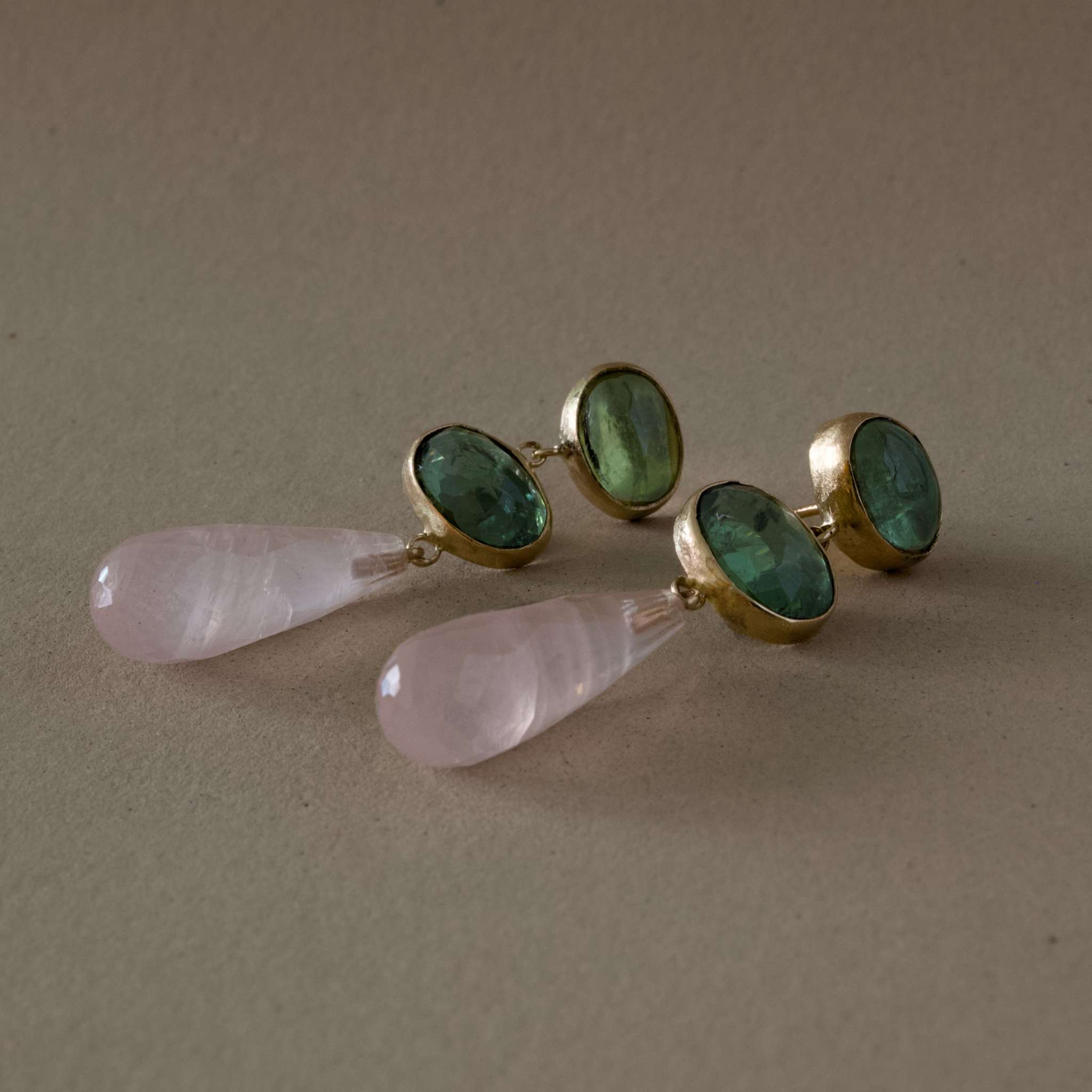 green tourmaline rose quartz earrings with hand-cut green tourmaline and rose quartz drops in rich gold.