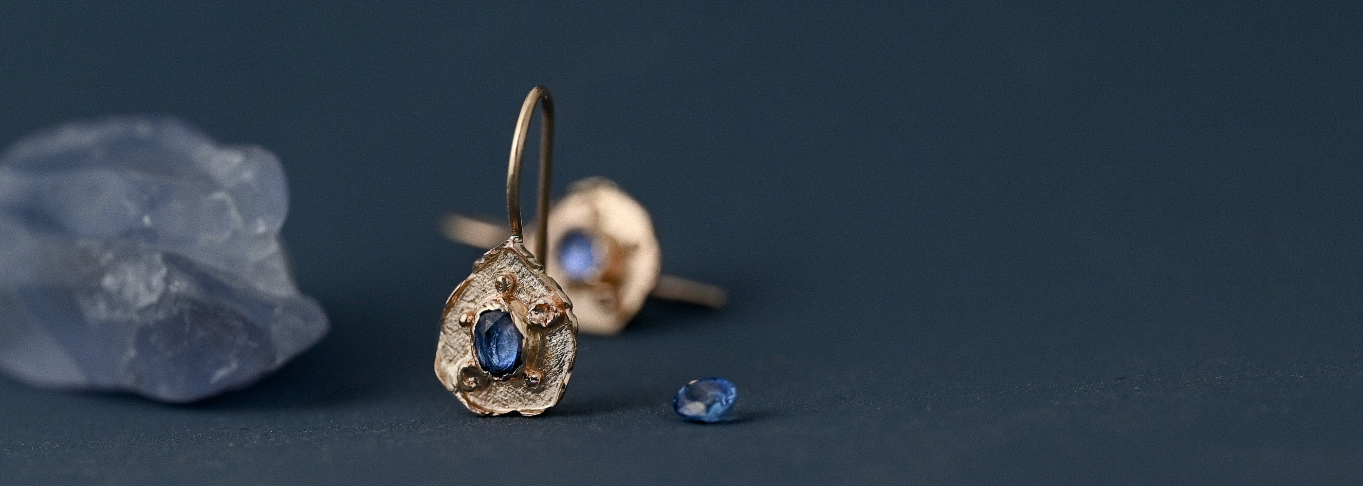 florin sapphire earrings in 14ct gold with blue crystal and loose blue sapphire