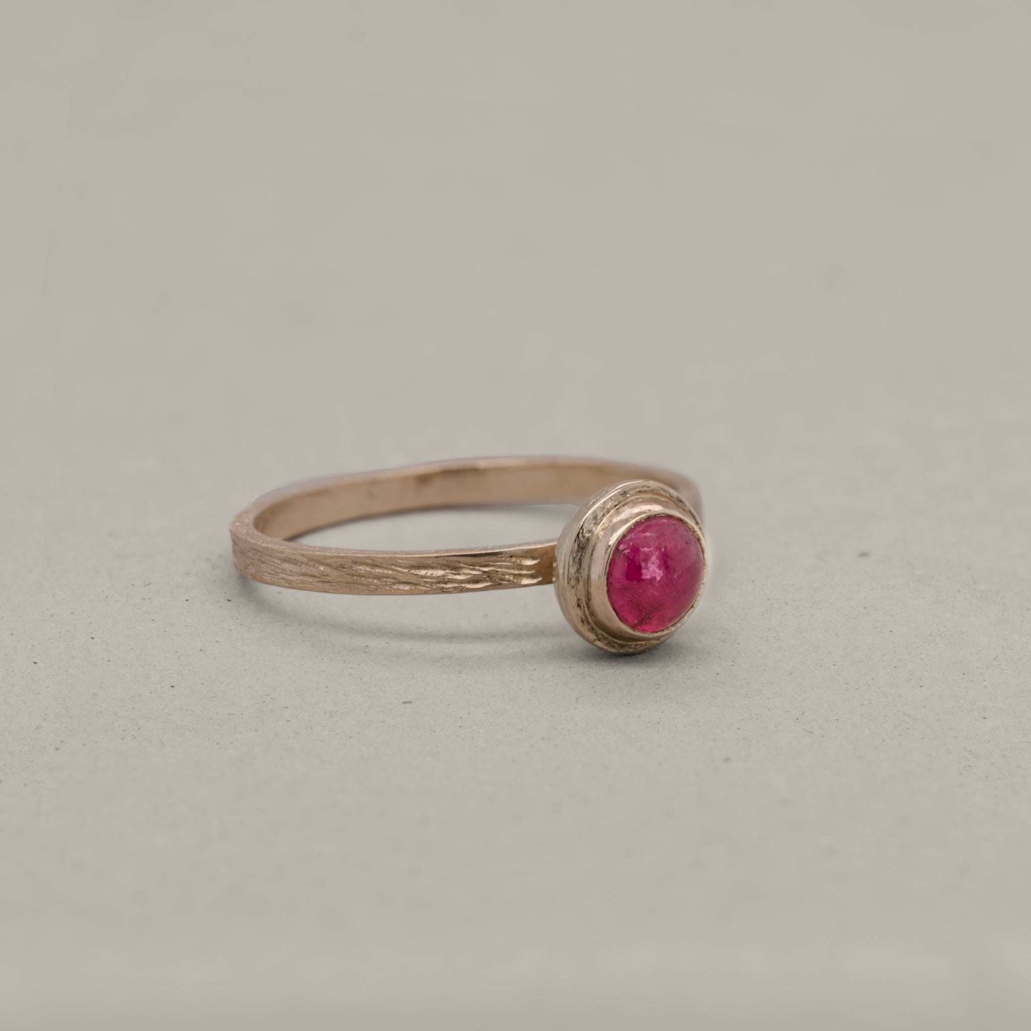 Soletta Pink Tourmaline Ring with brushed gold band and vibrant pink tourmaline gemstone