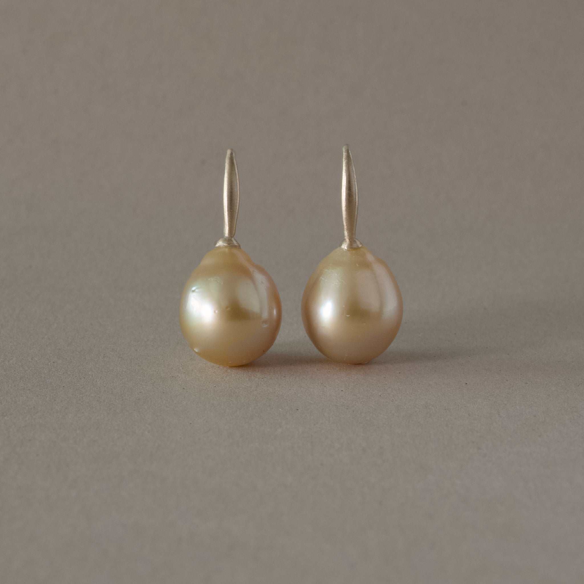 Golden South Sea Pearl Earrings with handmade hooks, unique design.