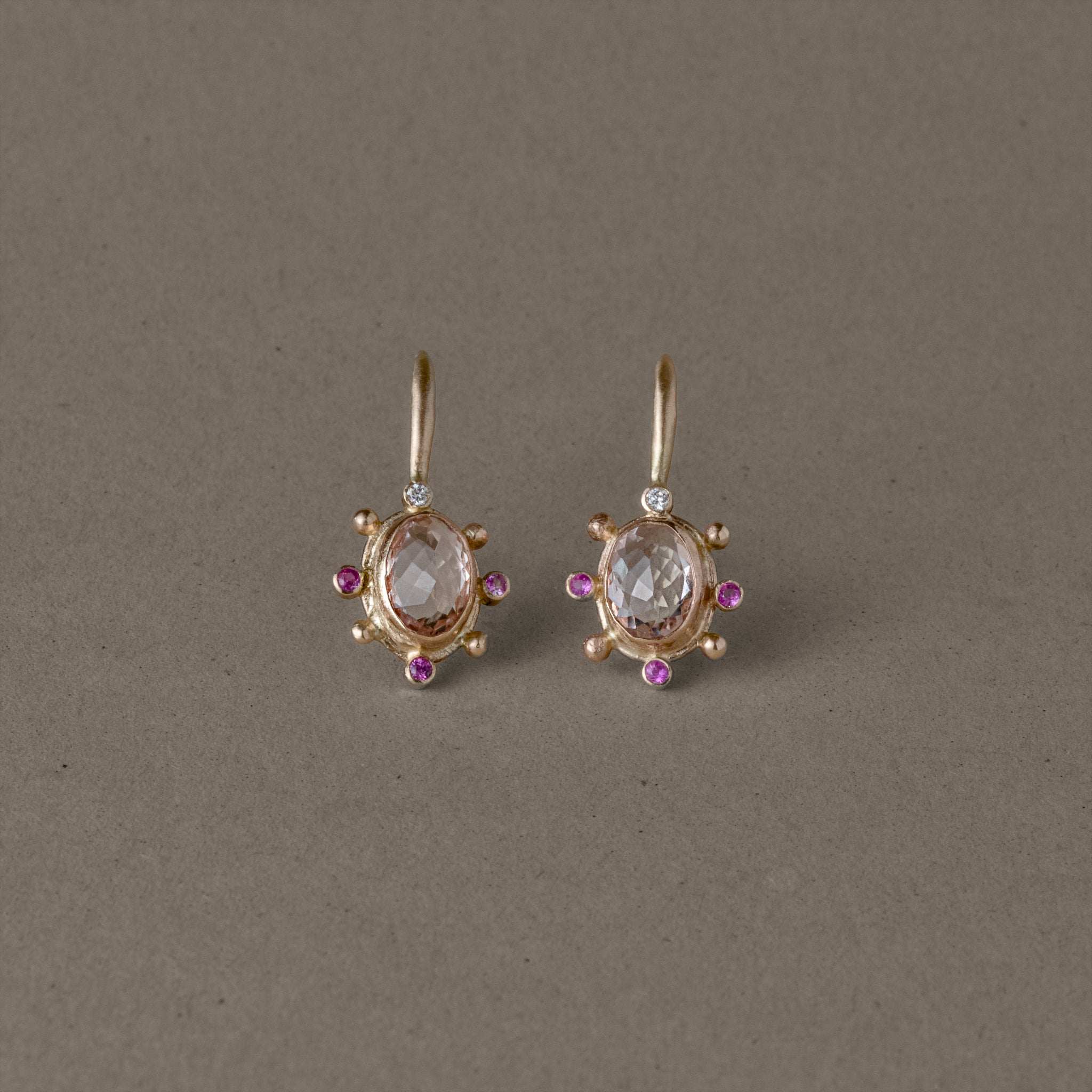 Elegant Stella Morganite Sapphire Earrings with gold and diamond accents.