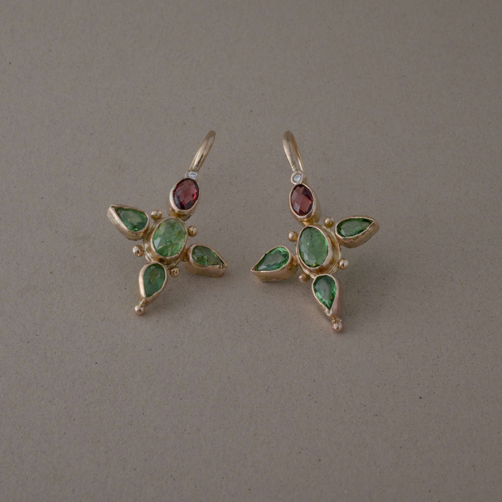 Tsavorite diamond earrings with rhodolite garnets in 14ct gold.