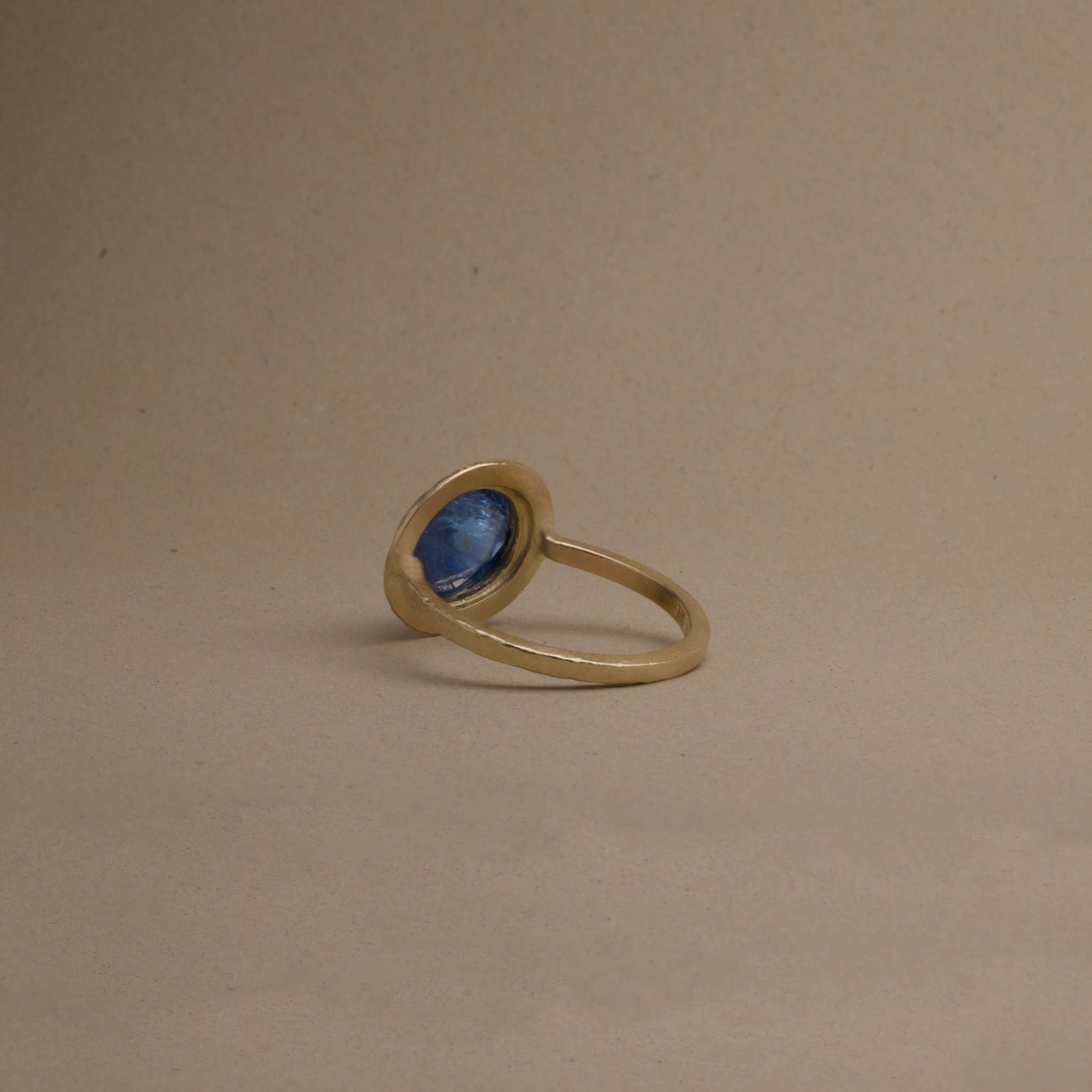 artisan crafted uno burma sapphire ring  in 14ct gold with unheated Burmese sapphire, textured design.