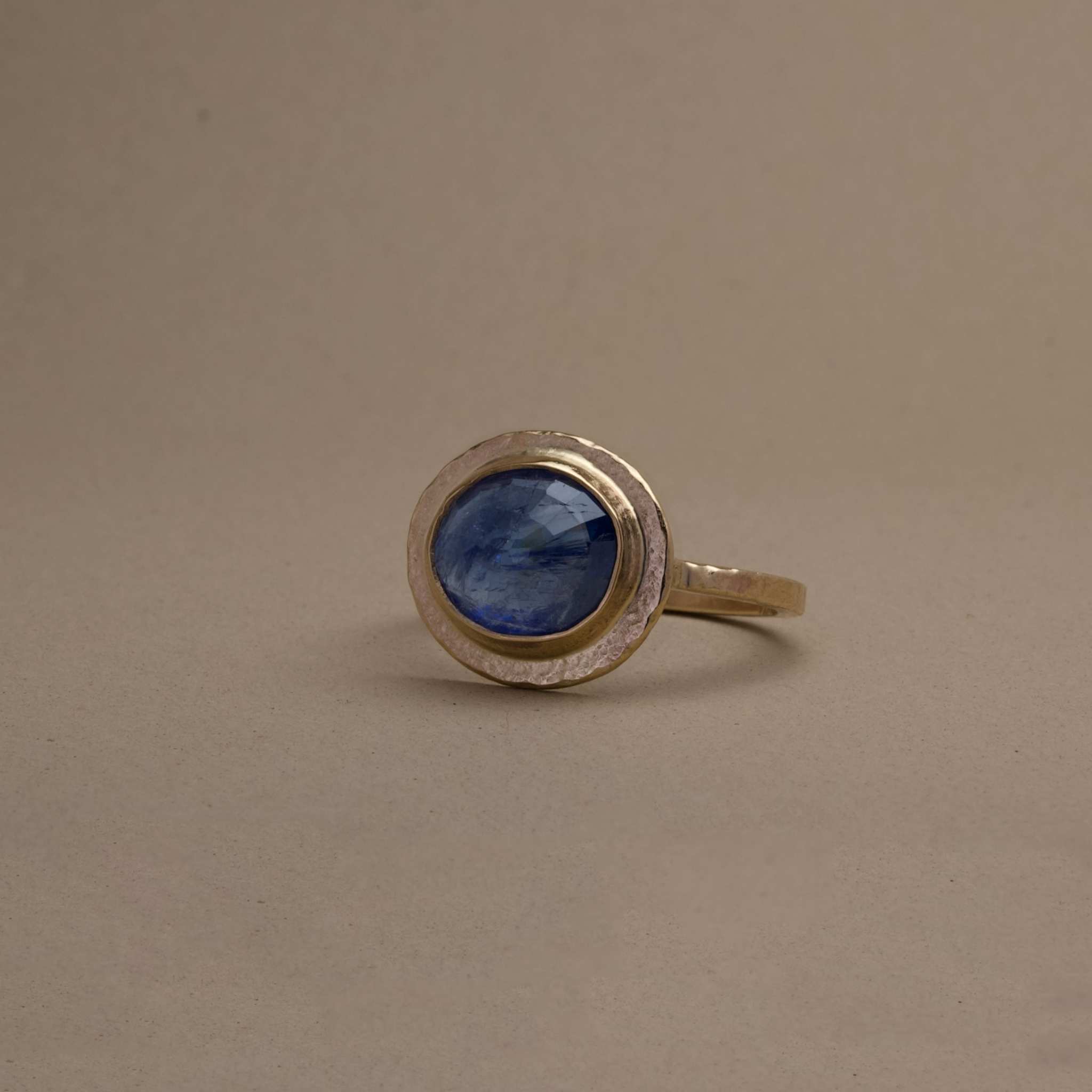 artisan crafted uno burma sapphire ring featuring unheated Burmese sapphire set in 14ct textured gold.